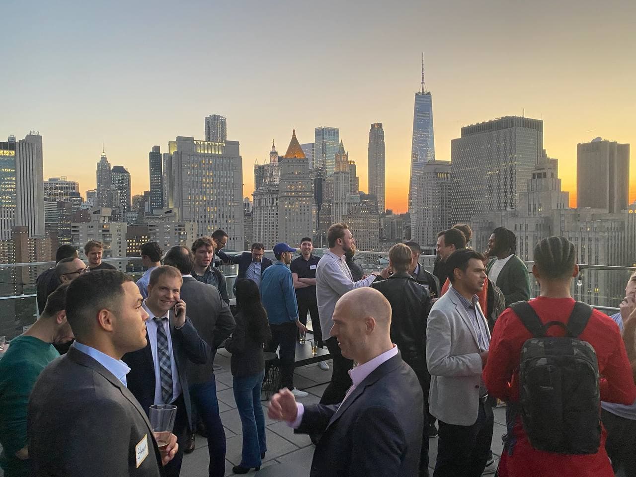Golden-hour crowd at a Startup Valley pitch night in New York